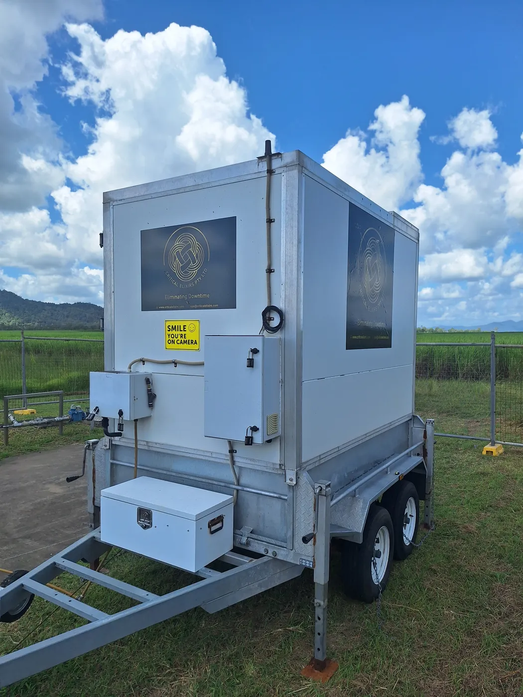 Side view of a deployed Critical Elixirs trailer-mounted dosing station